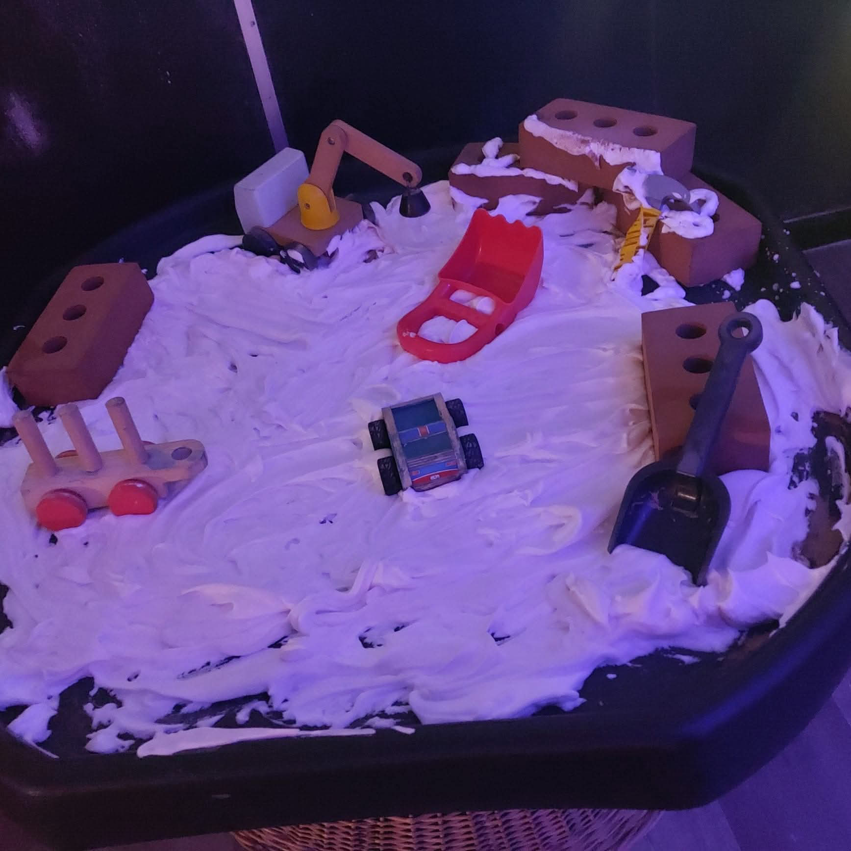 Children exploring activity resources at our Fforestfach nursery